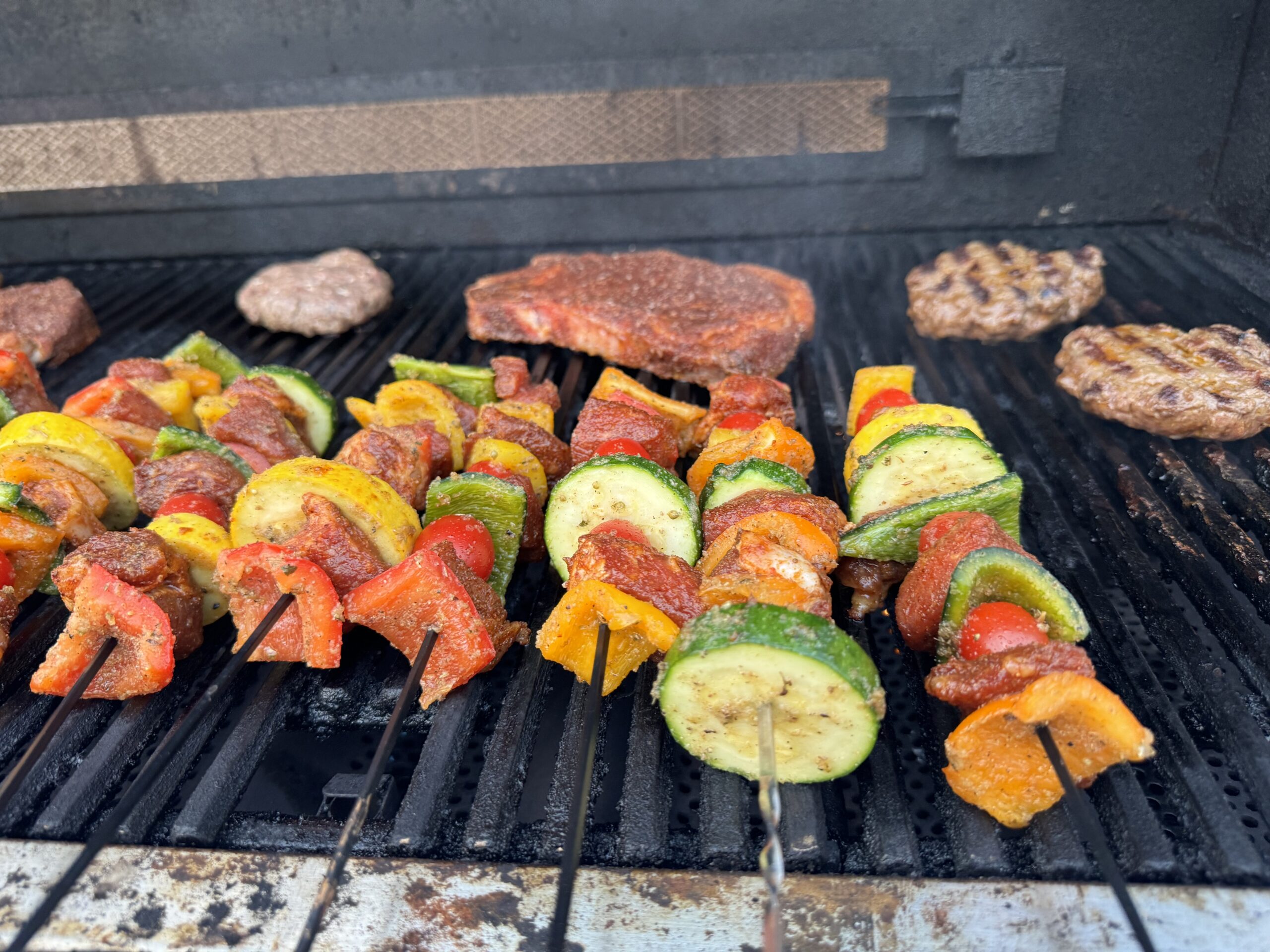 Shish kebabs cooking on grill